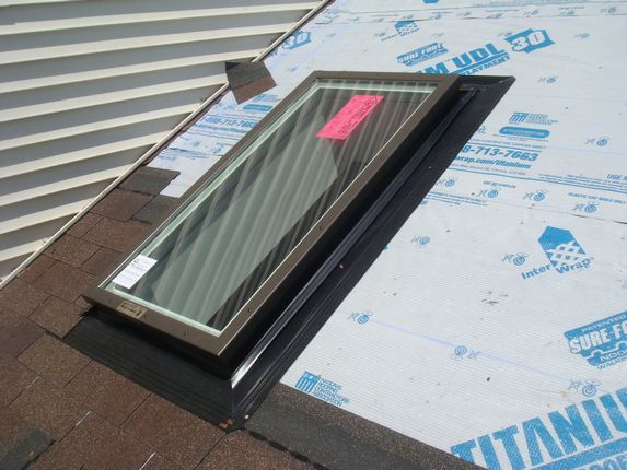 Skylight flashing integrates pefectly with new Certainteed Shingles